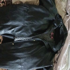 A leather men coat with a hood on to it